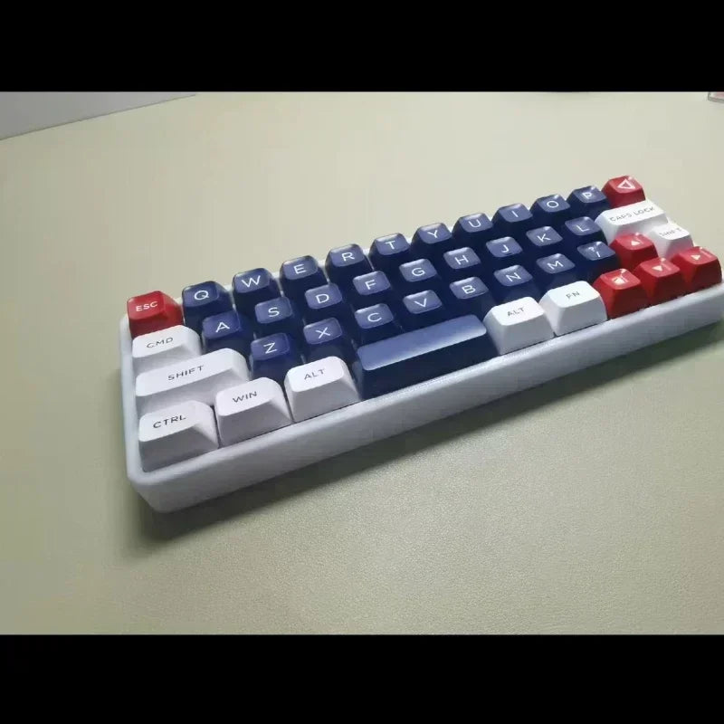 Side view of a 40% mechanical keyboard with white case and blue/red keycaps