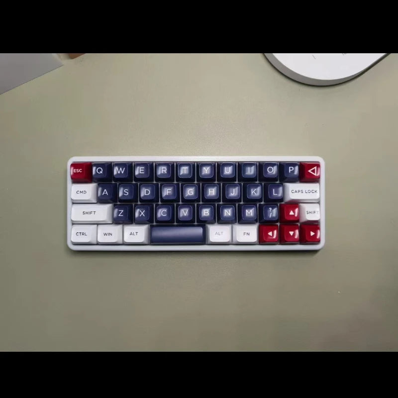 40% hot-swappable mechanical keyboard, top view with blue keys, white legends, red corner keys