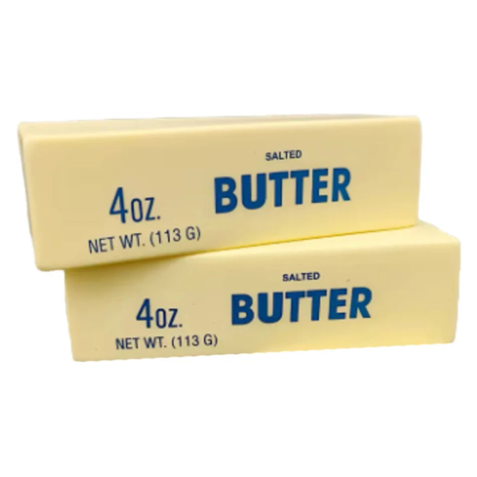 Two yellow squishy butter stick toys labeled SALTED BUTTER 4oz each