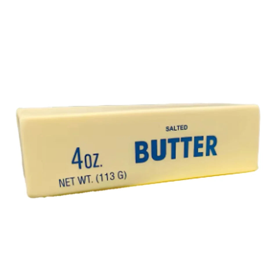 Yellow squishy butter stick toy labeled SALTED BUTTER 4oz, net wt 113g