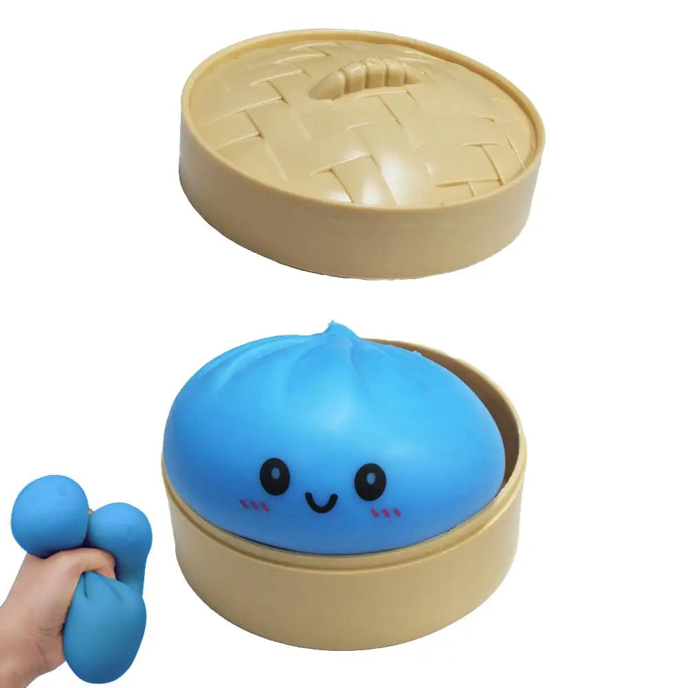 Blue squishy dumpling bun stress toy with smiling face, pinchable lid
