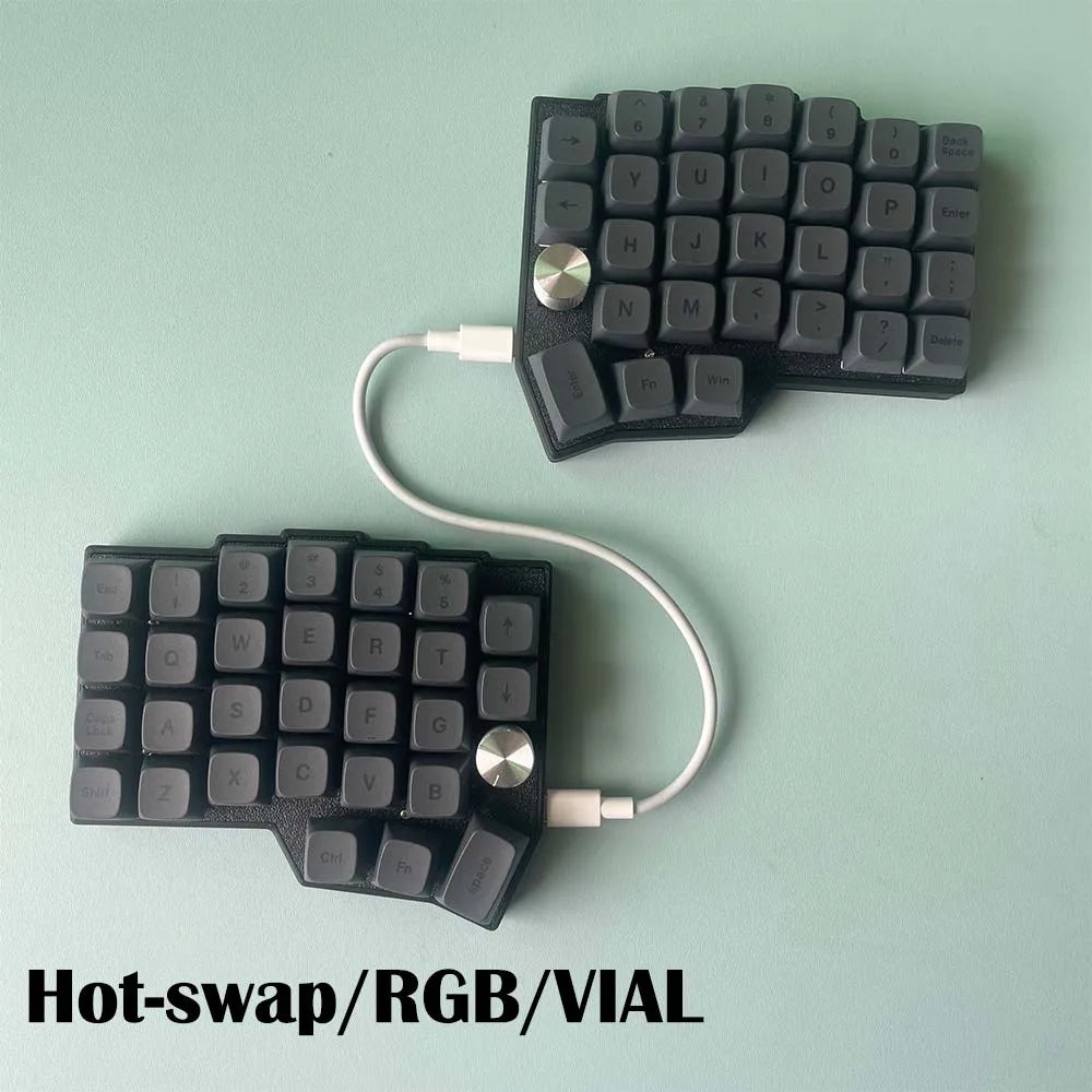 Split ergonomic hot-swappable keyboard with two knob controllers and dark gray keys