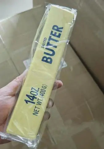 Individually wrapped yellow butter-shaped squishy fidget toy, 14oz loaf