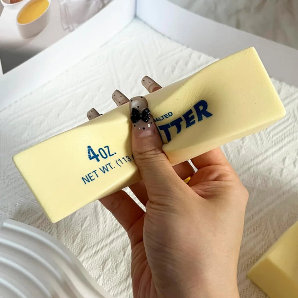 Yellow salted butter-stick squishy fidget toy with 4oz 113g label
