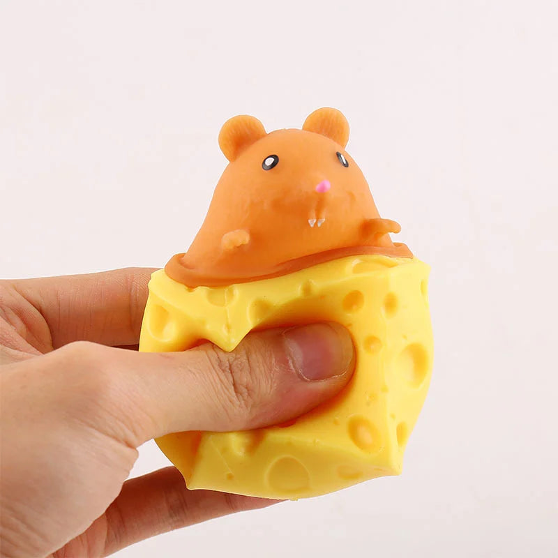 Orange mouse face on a triangle yellow cheese squishy toy with round hole details.