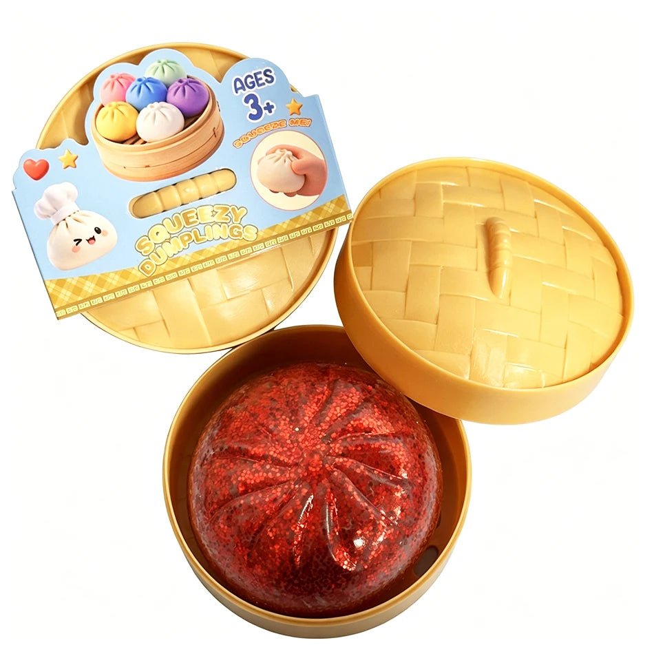 Red glitter dumpling stress-relief squishy in gold tray with open lid