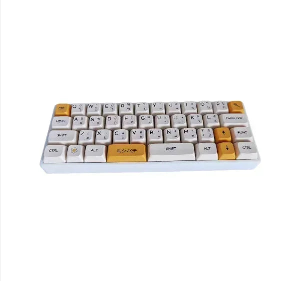 40% hot-swappable mechanical keyboard, white keycaps with yellow accent keys.