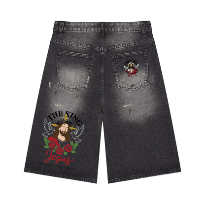 Black wide-leg denim shorts with vintage wash and winged Jesus graphic on right pocket
