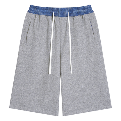 Heather gray unisex plaid-waistband shorts with drawstring and side pockets