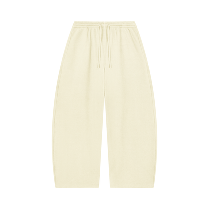 Unisex barrel-leg pants in oat-cream with elastic waistband and drawstring
