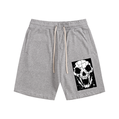 Dark gray cotton shorts with elastic waistband, drawstring, side pockets, and skull front graphic.