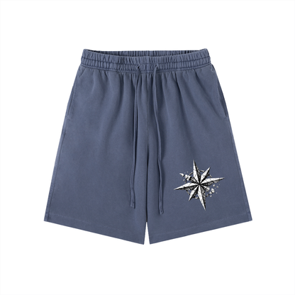 Navy vintage-wash cotton shorts with elastic waistband, drawstring, and side star graphic.