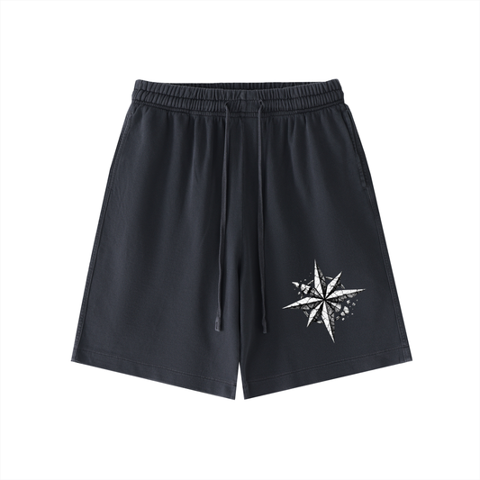 Black vintage-wash cotton shorts with elastic waistband, drawstring, and star graphic