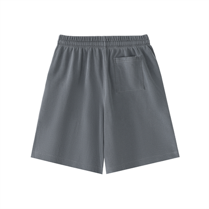 Charcoal gray vintage-wash cotton shorts with elastic waistband, drawstring, and front patch pocket.