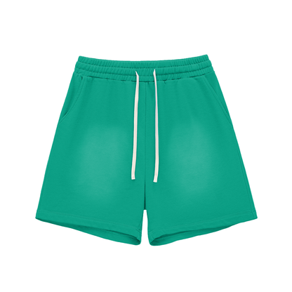 Green cotton shorts with elastic waistband, drawstring, straight hems