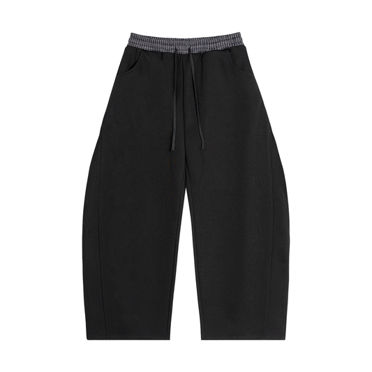 Black barrel sweatpants with plaid elastic waistband and drawstring