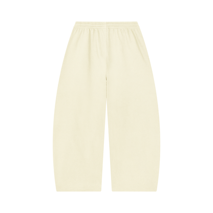 Cream barrel-leg pants with elastic waist and drawstring, loose tapered legs