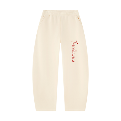 Ivory barrel-leg unisex sweatpants with red logo and elastic waistband
