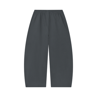 Unisex barrel-leg pants in dark charcoal with elastic waistband, back view